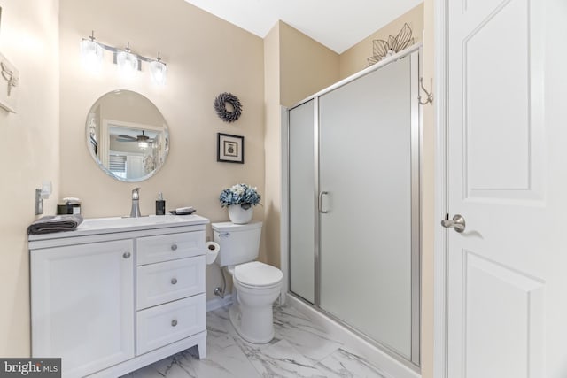 bathroom featuring vanity, ceiling fan, toilet, and walk in shower