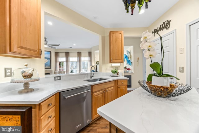 kitchen with dishwasher, sink, ceiling fan, dark hardwood / wood-style floors, and kitchen peninsula