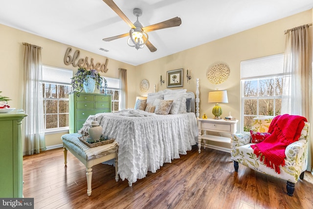 bedroom with ceiling fan and dark hardwood / wood-style floors