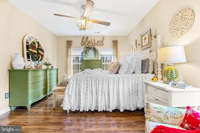 bedroom featuring ceiling fan and dark hardwood / wood-style flooring