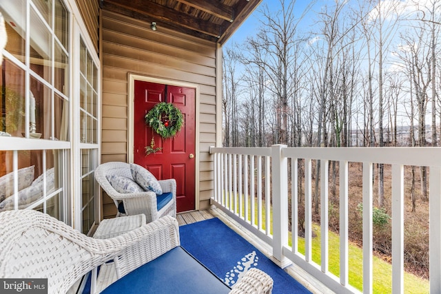 entrance to property featuring a balcony