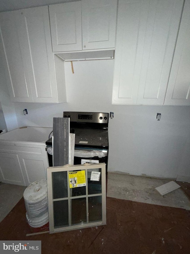 kitchen with white cabinets and black stove