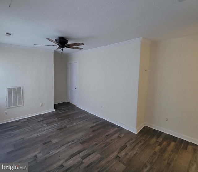 spare room with ceiling fan, dark hardwood / wood-style flooring, and ornamental molding