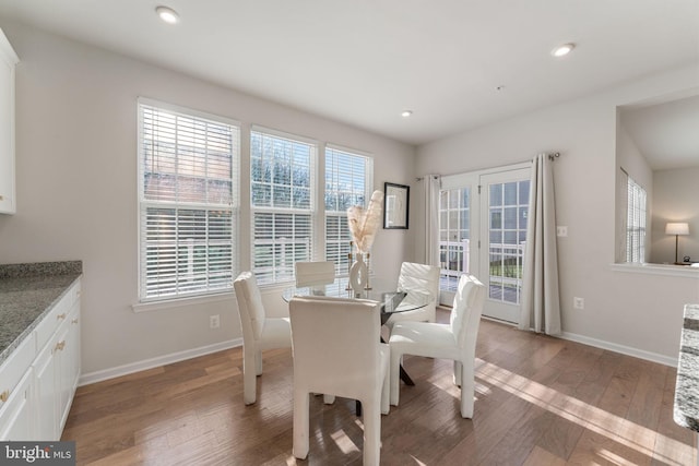 dining area with hardwood / wood-style flooring