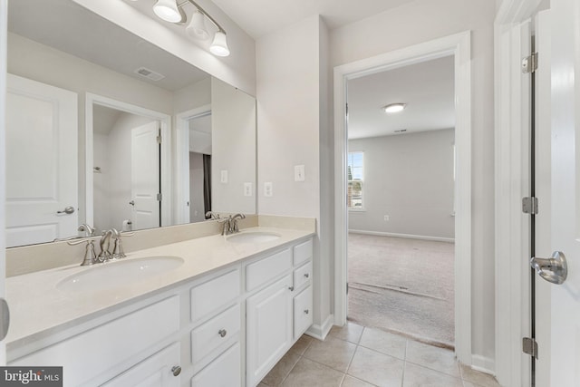 bathroom featuring tile patterned flooring and vanity