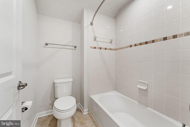 bathroom featuring tiled shower / bath and toilet