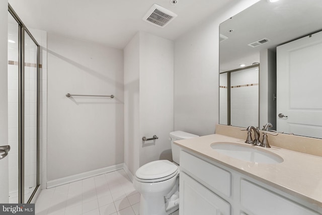 bathroom with vanity, an enclosed shower, and toilet