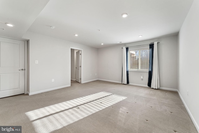 unfurnished room with light colored carpet