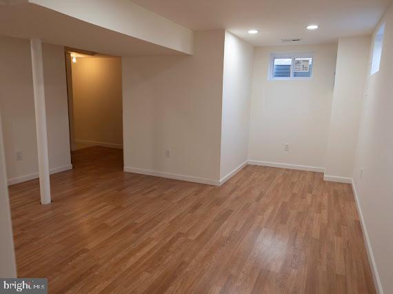 basement featuring light hardwood / wood-style floors