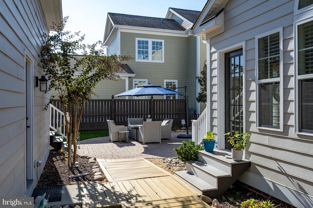 wooden deck with a patio