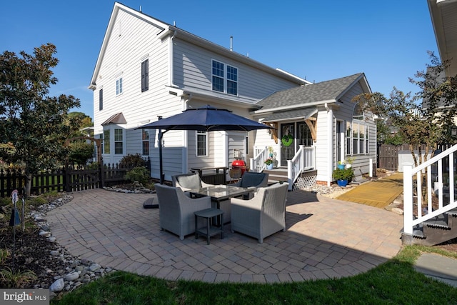 rear view of house featuring a patio