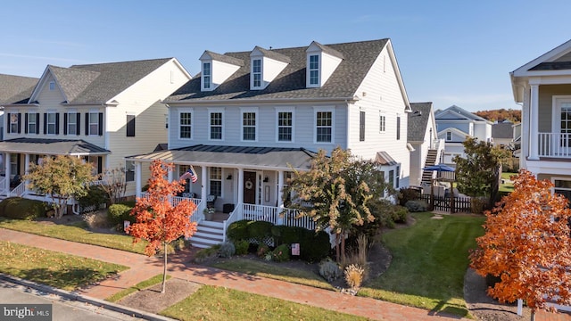 view of front of home featuring a front lawn and a porch