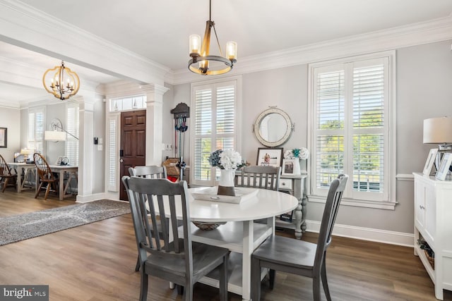 dining space featuring a notable chandelier, a healthy amount of sunlight, and dark hardwood / wood-style flooring