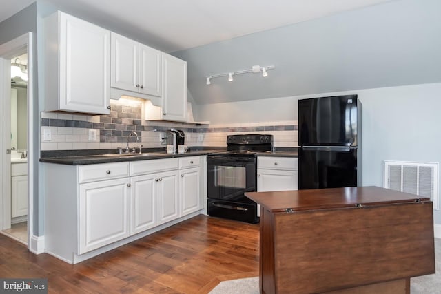 kitchen featuring white cabinetry, sink, tasteful backsplash, dark hardwood / wood-style flooring, and black appliances