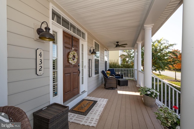 wooden deck with ceiling fan