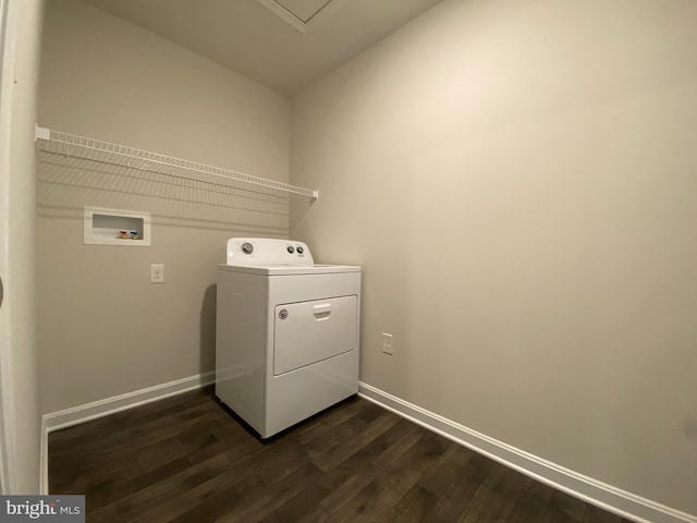 laundry area with dark hardwood / wood-style floors and washer / clothes dryer