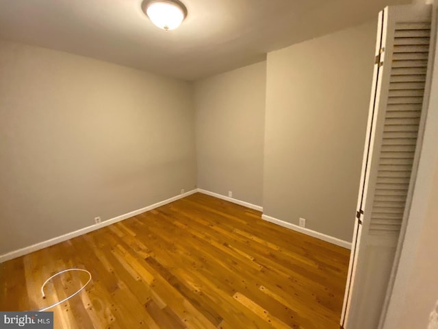 empty room with hardwood / wood-style floors