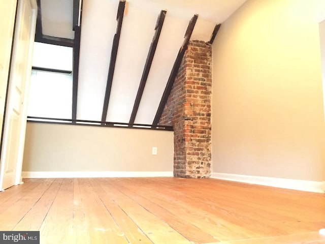 unfurnished living room with hardwood / wood-style floors