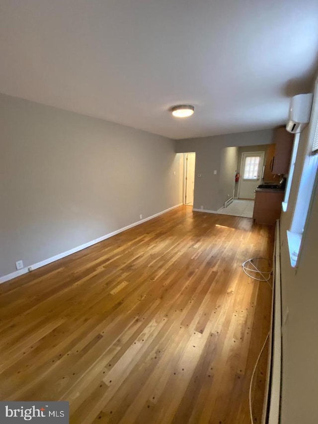 spare room with hardwood / wood-style floors