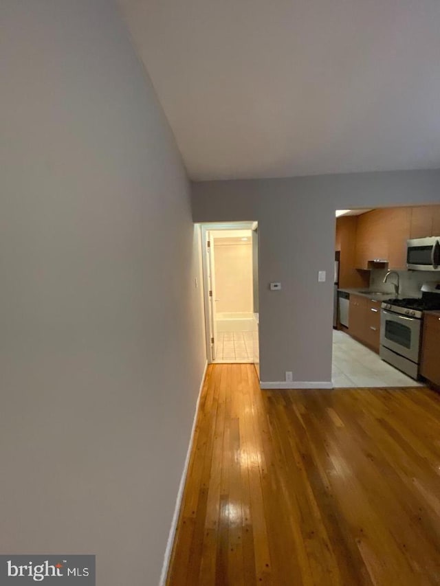 interior space featuring light hardwood / wood-style floors and sink