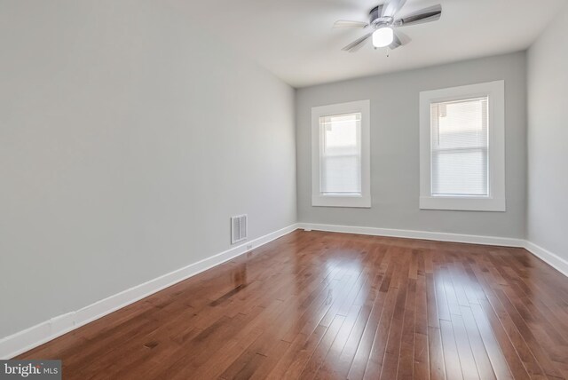 spare room with wood-type flooring and ceiling fan