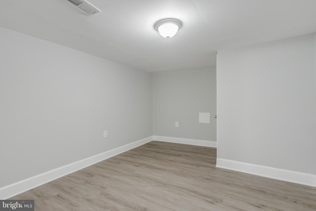 empty room with light hardwood / wood-style floors