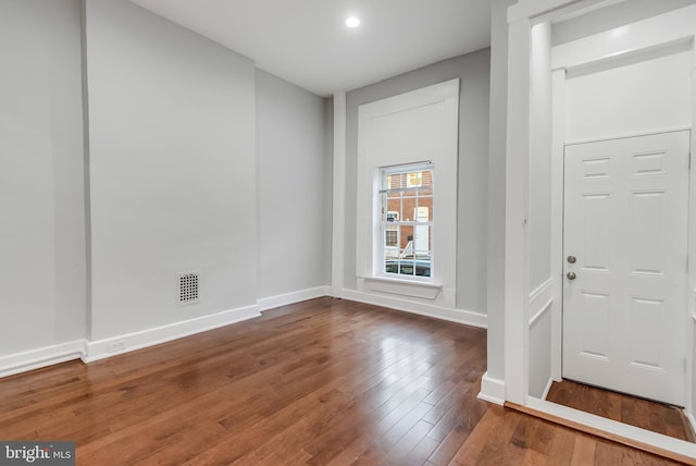 entryway with hardwood / wood-style flooring