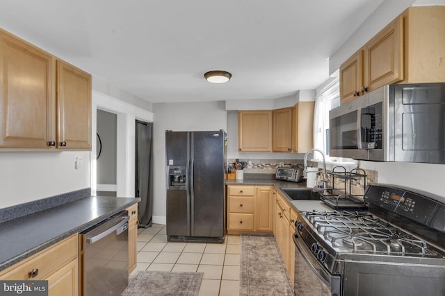 kitchen featuring black appliances, light tile patterned flooring, sink, and light brown cabinetry