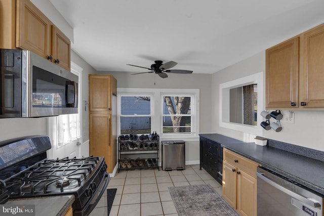 kitchen with ceiling fan, light tile patterned floors, and stainless steel appliances