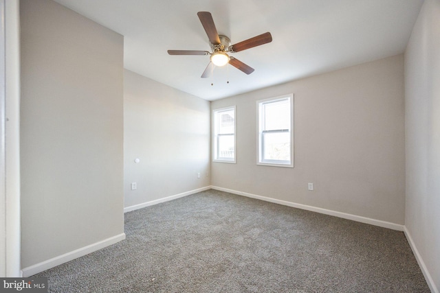 empty room featuring carpet flooring and ceiling fan