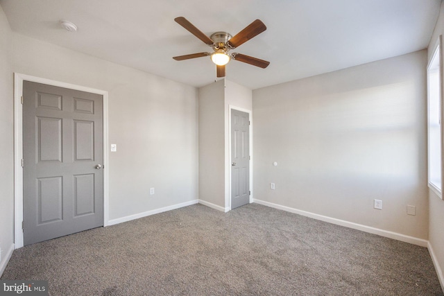 carpeted empty room with ceiling fan