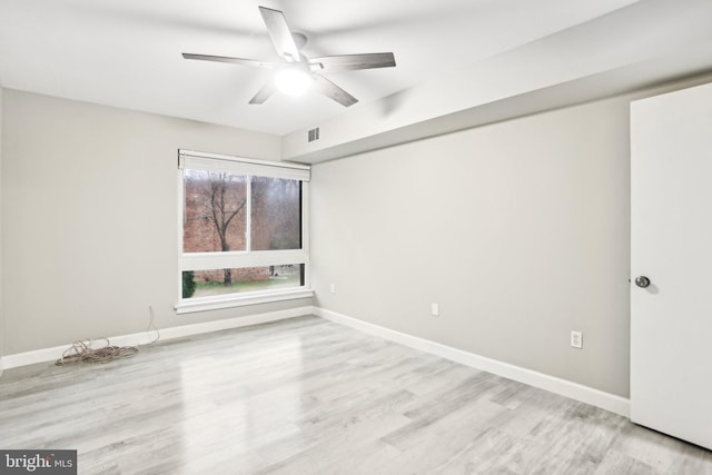 unfurnished room featuring light wood-type flooring and ceiling fan