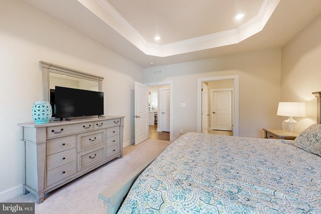 carpeted bedroom featuring a tray ceiling and crown molding