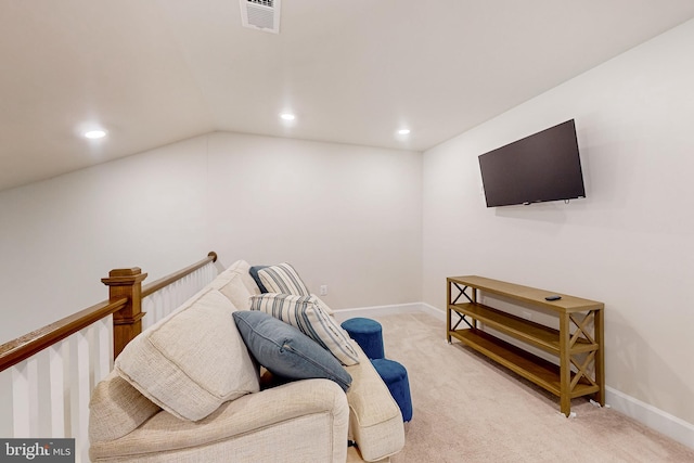 living area with light carpet and lofted ceiling