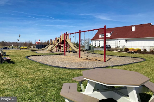 view of jungle gym featuring a lawn and central air condition unit