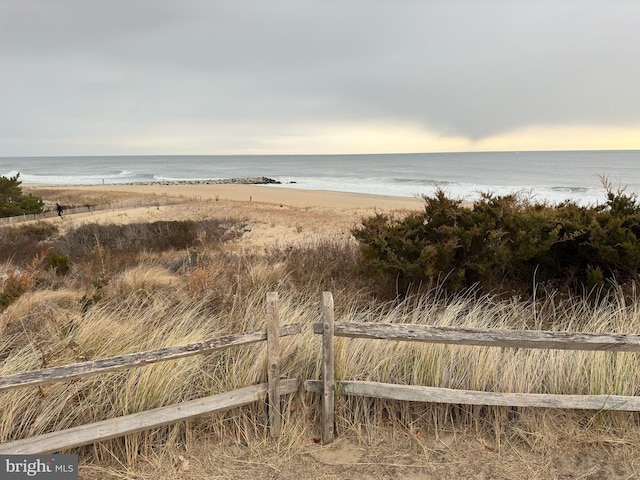 property view of water featuring a beach view