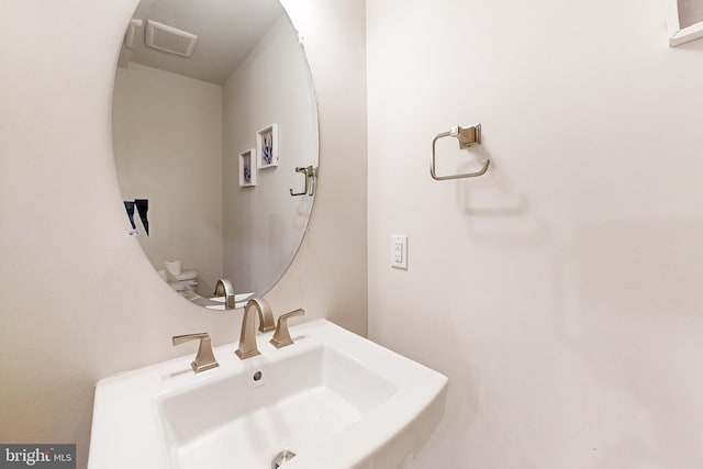 bathroom with sink and toilet