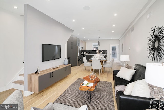 living room with light hardwood / wood-style floors