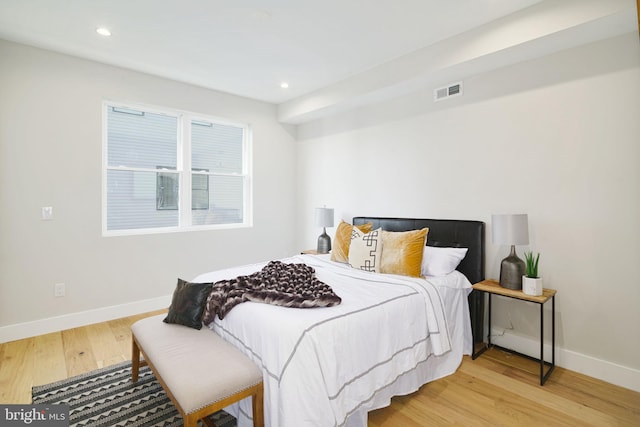 bedroom with light hardwood / wood-style floors