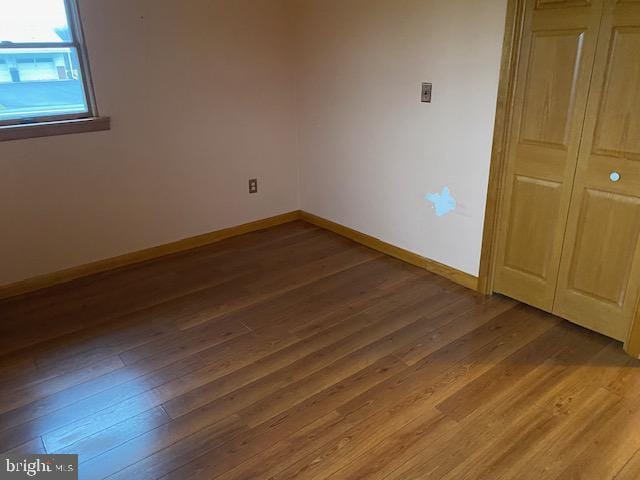 unfurnished bedroom with wood-type flooring