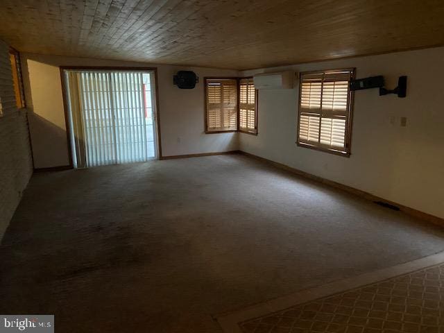 carpeted spare room with a wall mounted air conditioner and vaulted ceiling