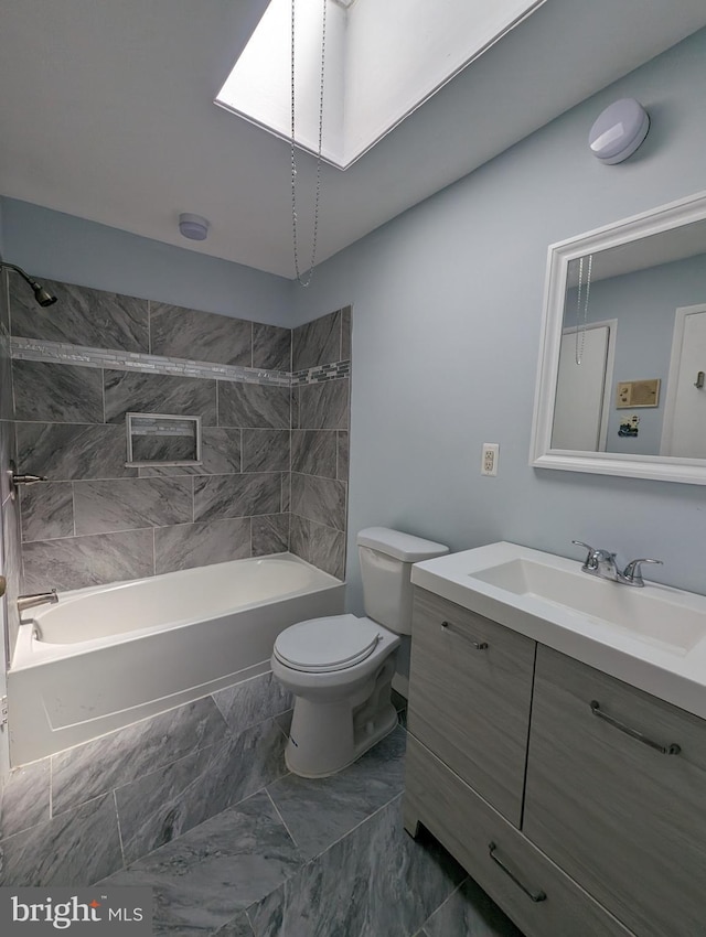 full bathroom featuring vanity, toilet, and tiled shower / bath