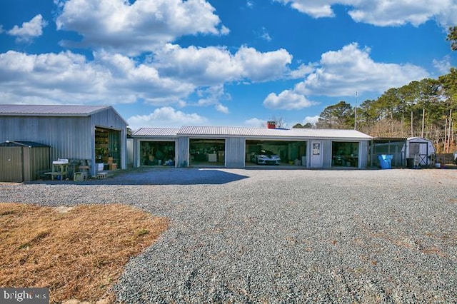 view of front of house featuring a shed