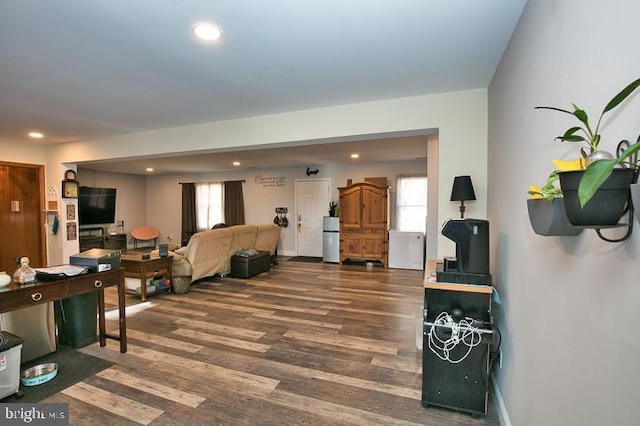 living room featuring dark wood-type flooring