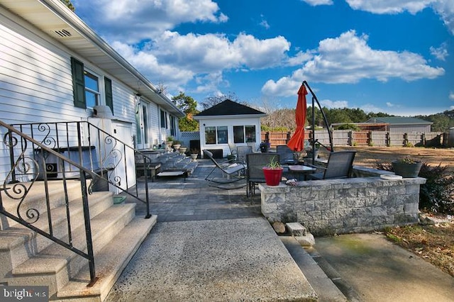 view of patio / terrace featuring a fire pit