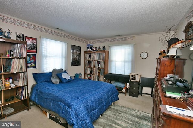 carpeted bedroom with a textured ceiling