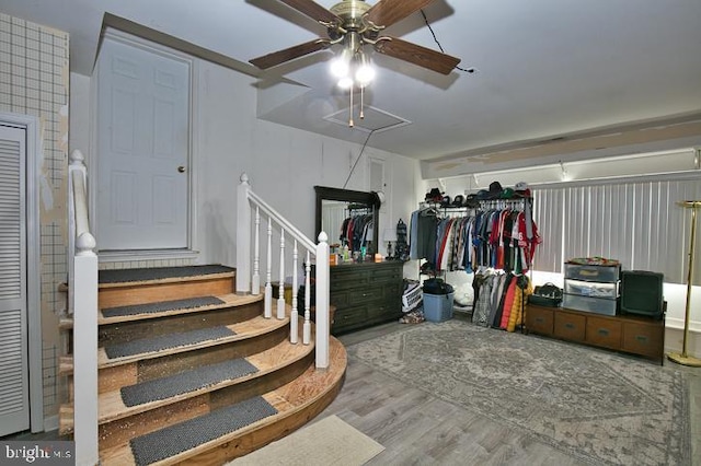 interior space featuring hardwood / wood-style flooring and ceiling fan