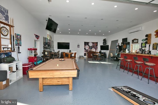 rec room featuring an AC wall unit and billiards