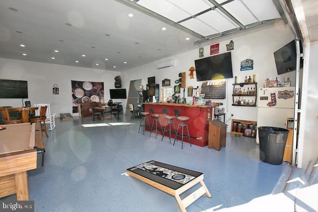 interior space featuring bar area, a wall mounted AC, and pool table