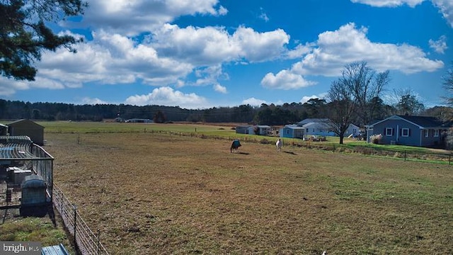 view of yard with a rural view